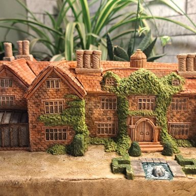 Unique bespoke hand sculpted miniature replica homes houses and wedding venues