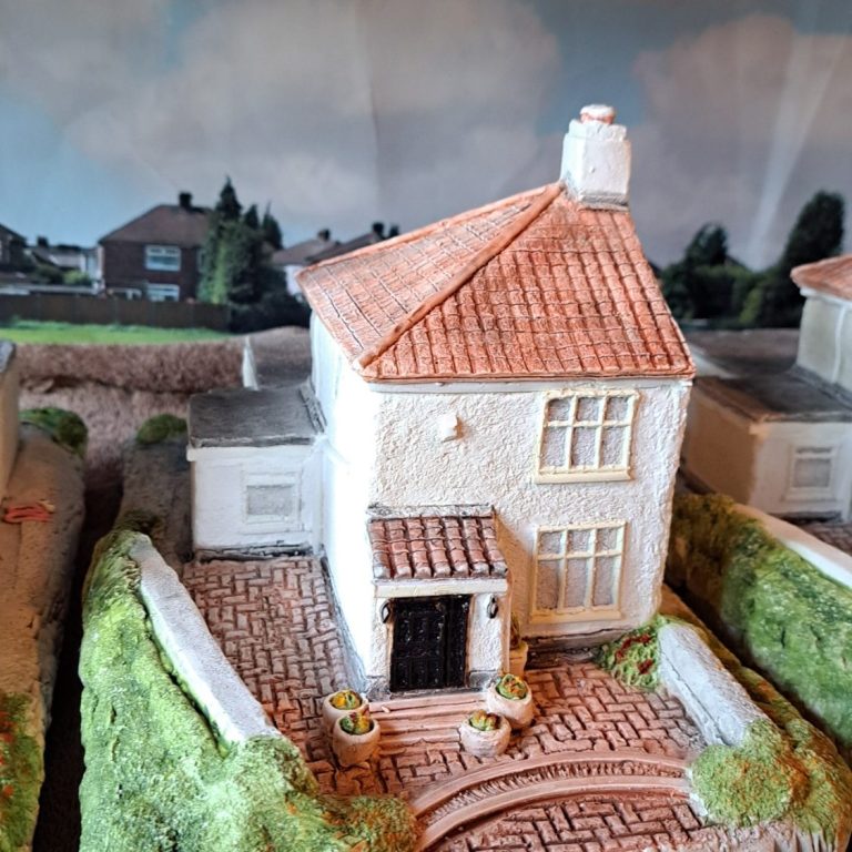 Unique bespoke hand sculpted miniature replica homes and houses and wedding venues